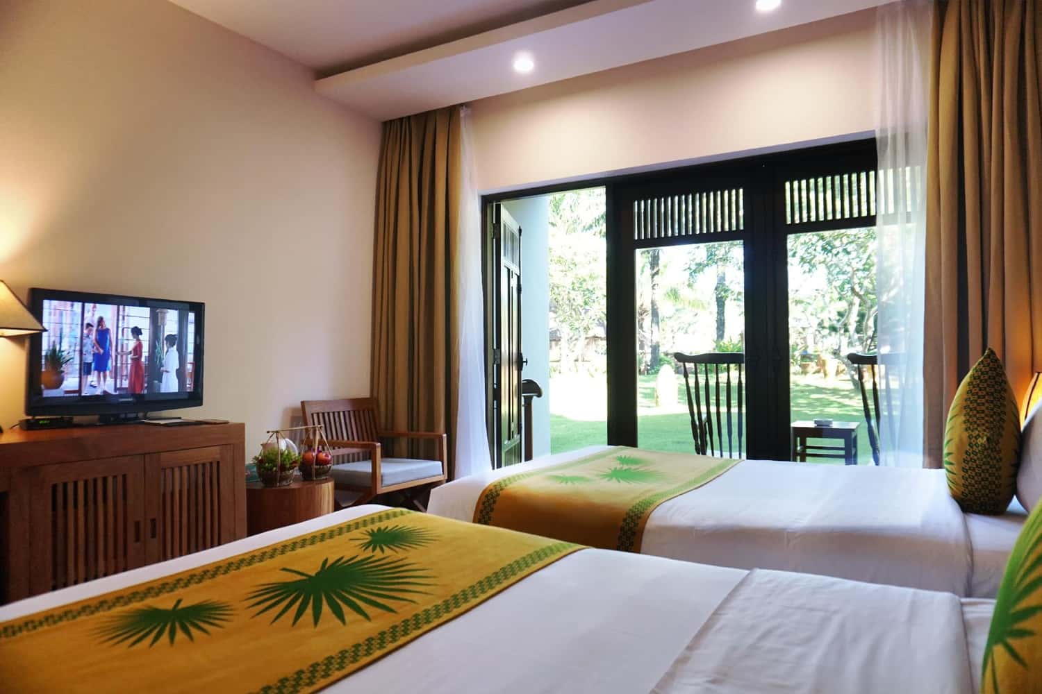 Phòng ngủ ở Khách sạn The Palm Garden Beach